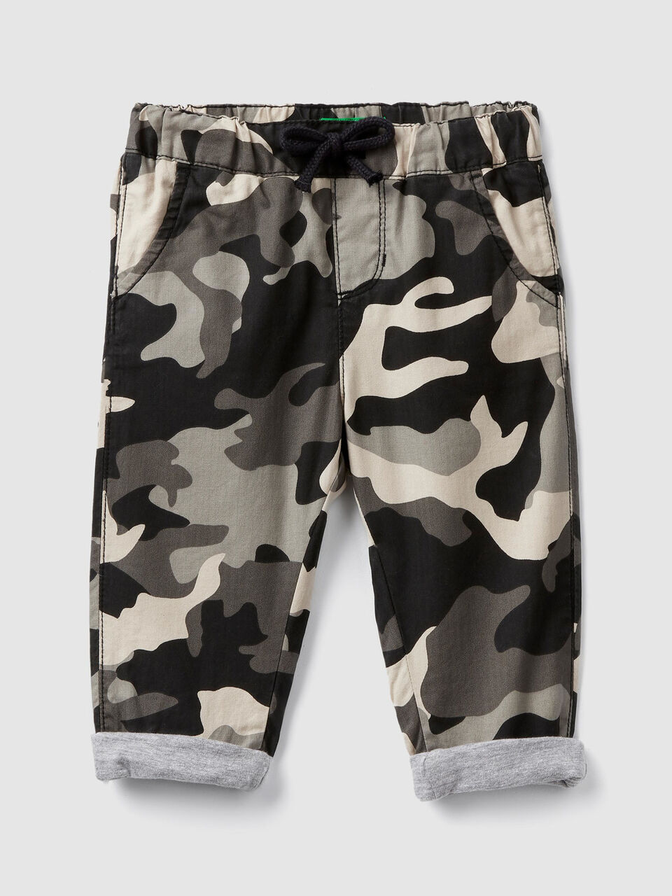 Camouflage print trousers image number 1