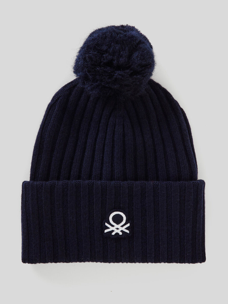Hat with logo and pom pom image number 1